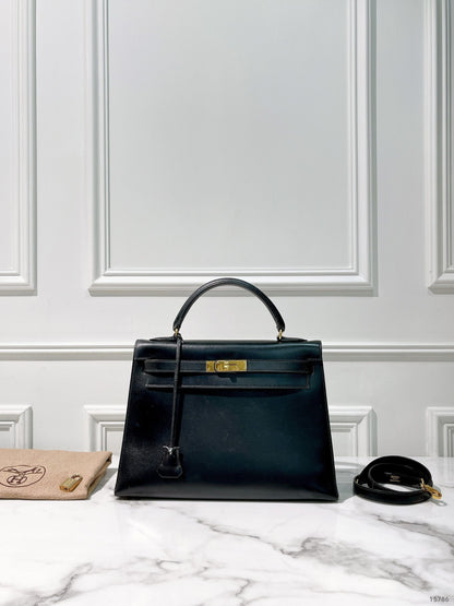 HERMES VINTAGE KELLY 32, NOIR/GOLD