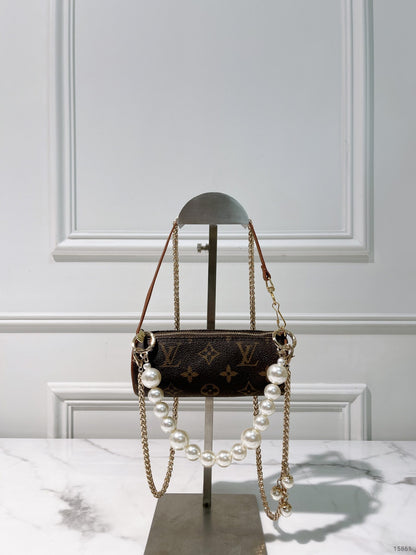 LV VINTAGE MINI ROLLER, MONOGRAM