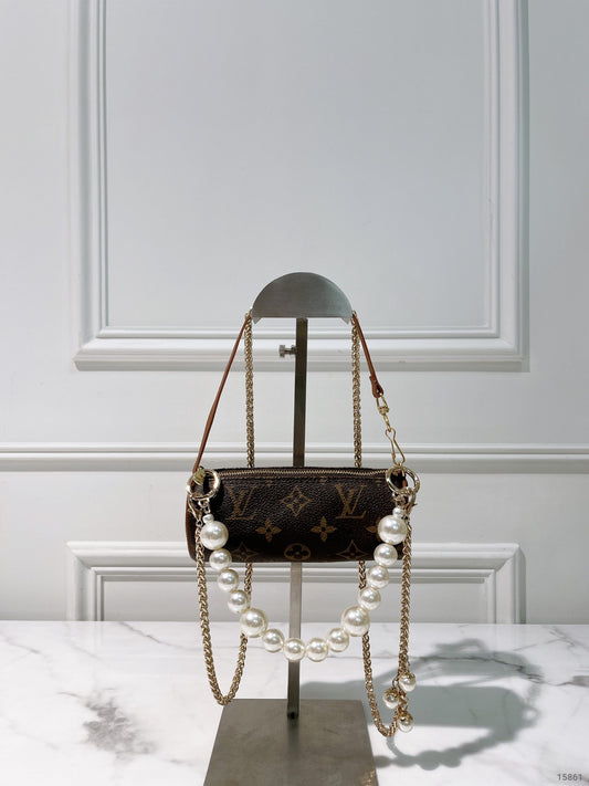 LV VINTAGE MINI ROLLER, MONOGRAM