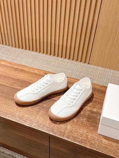 The Row Minimalist Low-Top Canvas Sneakers, Black