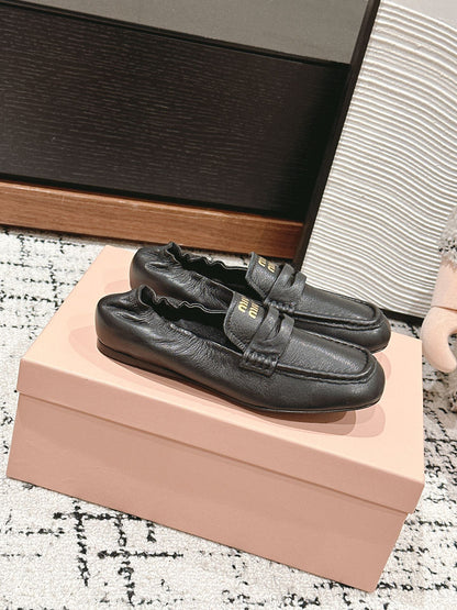 Miu Miu Embossed-logo Loafers, Black