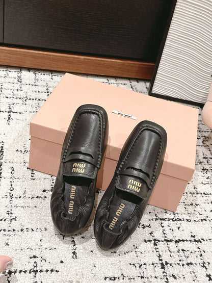 Miu Miu Embossed-logo Loafers, Black