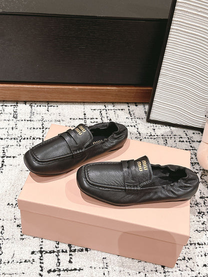 Miu Miu Embossed-logo Loafers, Black