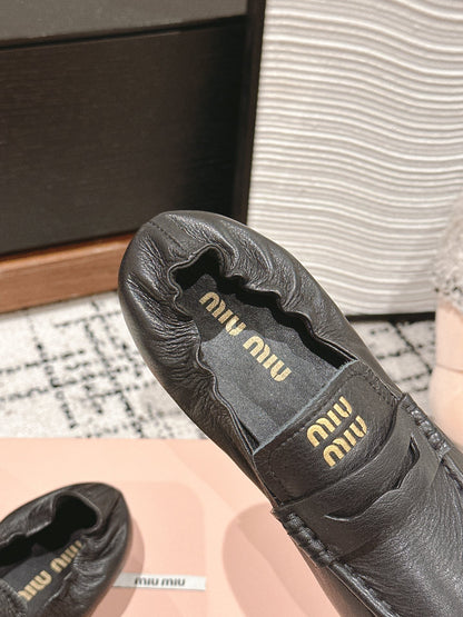 Miu Miu Embossed-logo Loafers, Black
